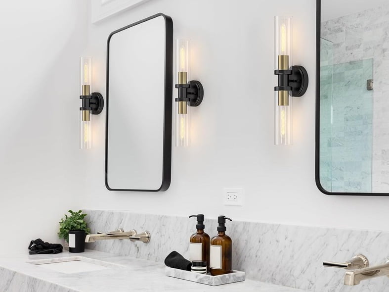 sconces wall lightening on the sids of bathroom mirror 