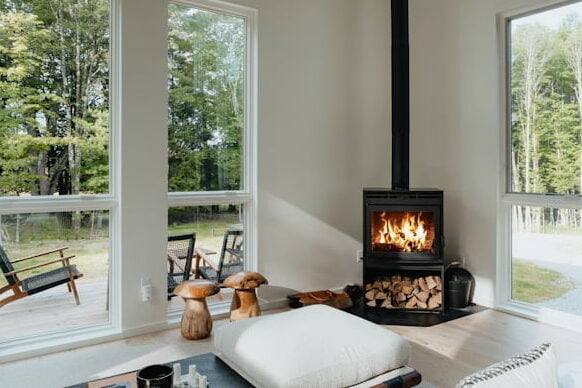 cozy and warmth Scandinavian interior design with fireplace and wood flooring and accessories