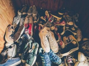 Pile of sneakers in wooden box