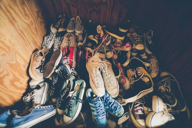 Pile of sneakers in wooden box