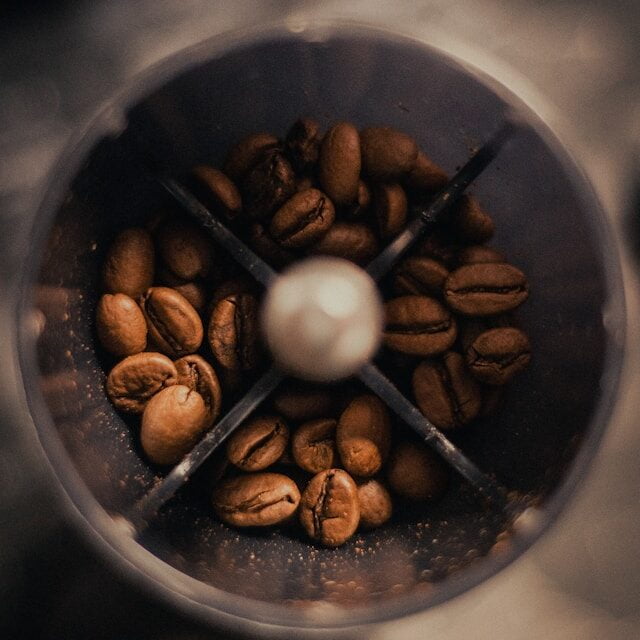 coffee beans in coffee grinder