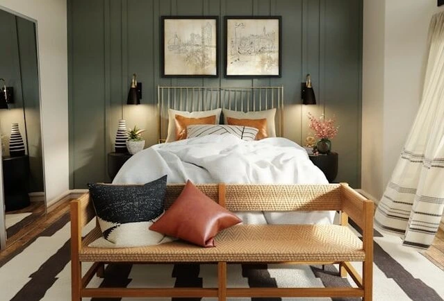 well design and balanced color pallet in the bedroom, brick tone leather pillow, sage green statement wall behind the bed 